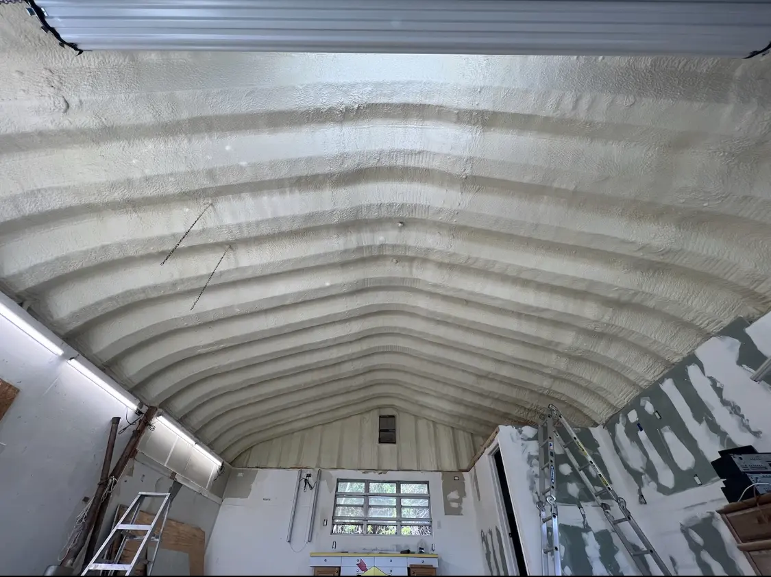 Spray polyurethane foam applied to the underside of a metal roof deck in Concord
